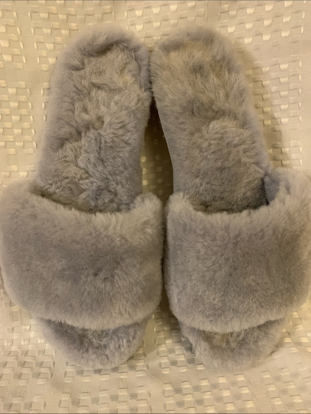 NUKNUUK women’s fluffy slip- on grey slippers, size 7.